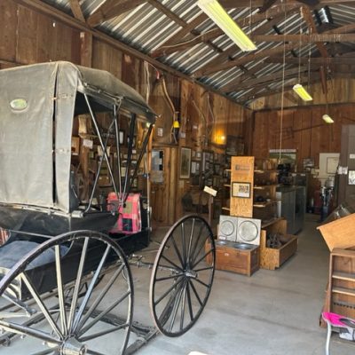 This is a photo of the doctor's buggy and the inside of the barn.